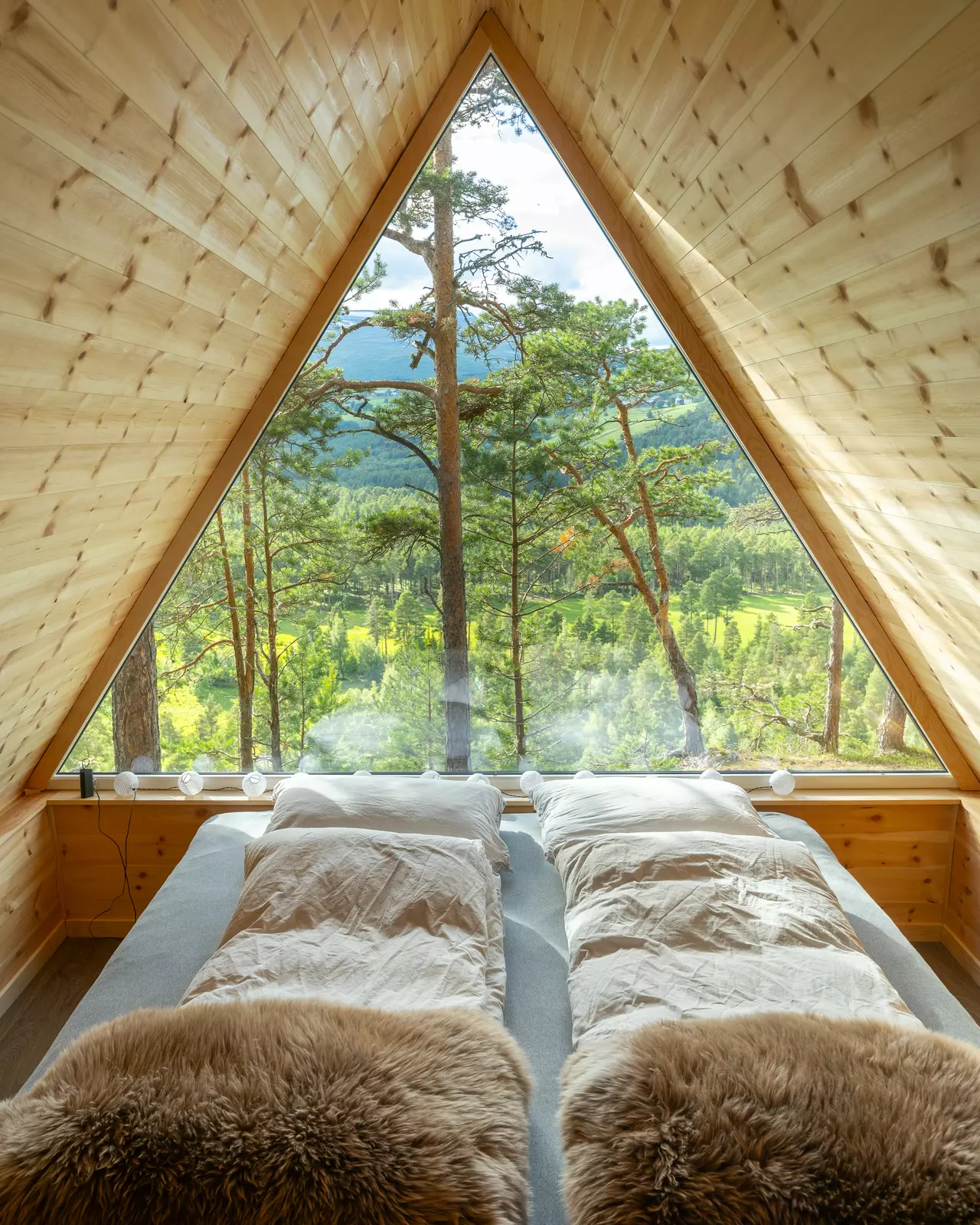 A-frame hut with mountain and river views